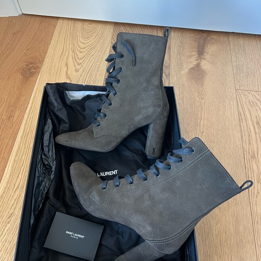 Saint Laurent's Loulou ankle boots, haunting green. Graphite metal logo on heels